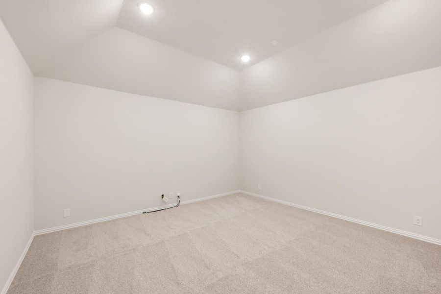 Empty room with white walls, beige carpet, and recessed ceiling lights Empty room with white walls, beige carpet, and recessed ceiling lights