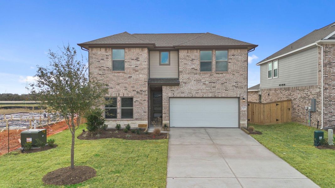 Front exterior of a new home in Windrose Green, Angleton, TX, highlighting curb appeal (Image 22).