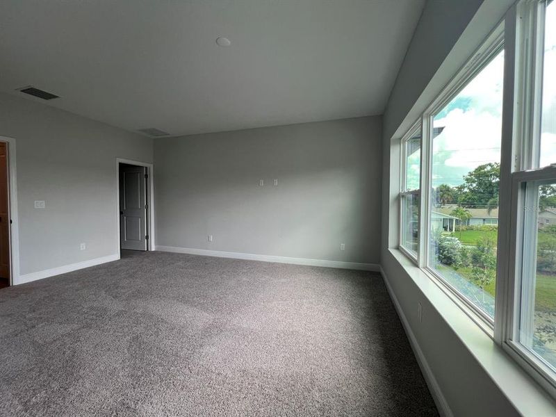 Spacious, unfurnished interior of a new home in The Towns At Long Bayou, Seminole (Image 21).