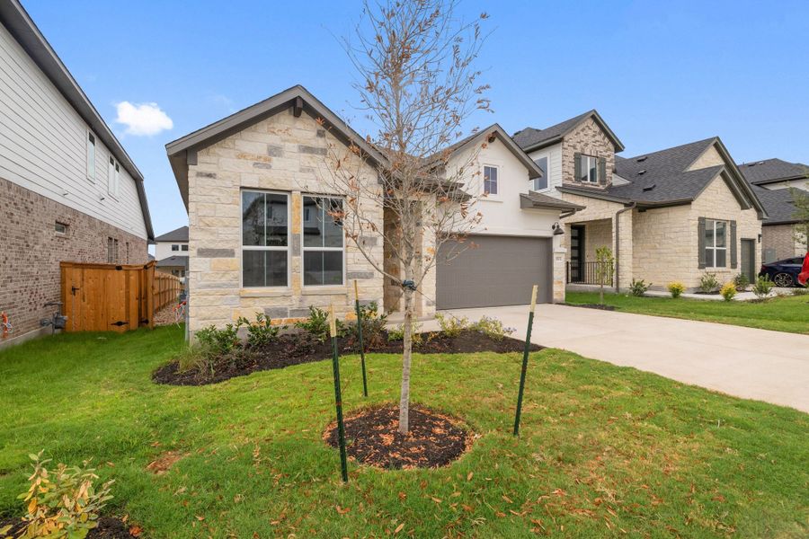 Front exterior of a new home in Heritage, Dripping Springs, TX, highlighting curb appeal (Image 24).