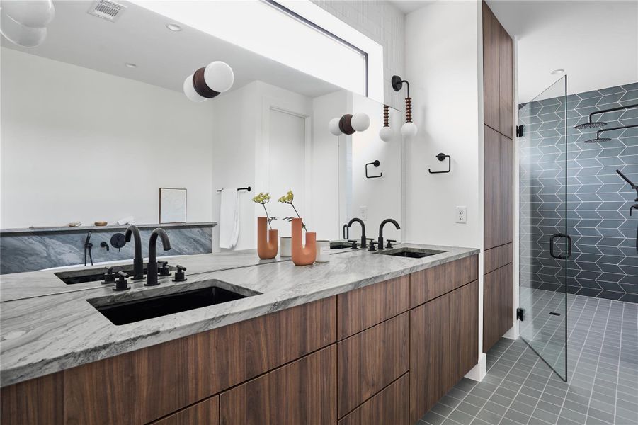 Dual floating vanities in primary bathroom