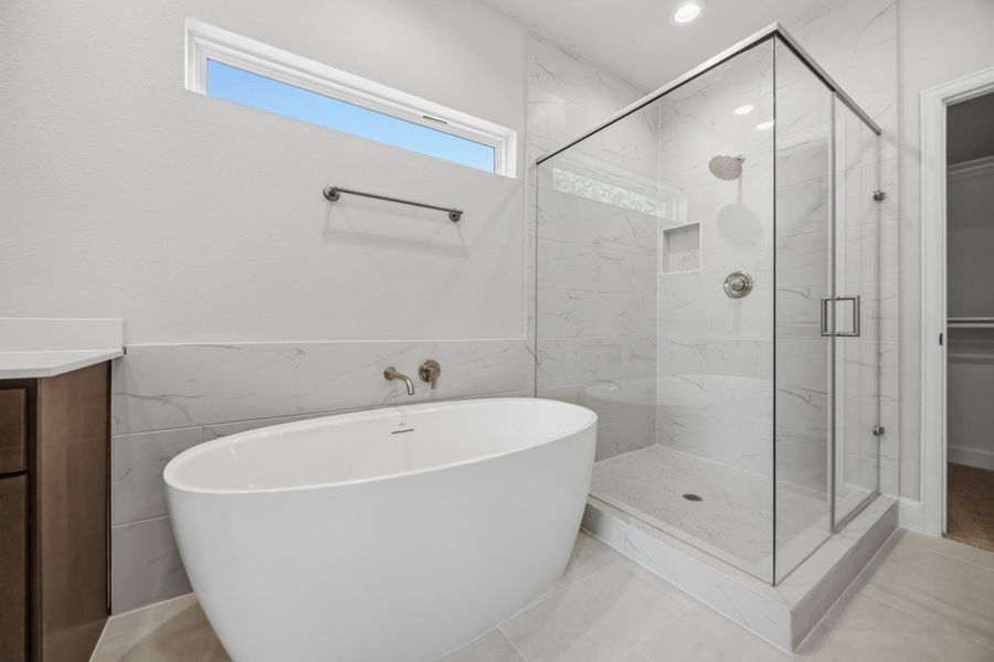 Retreat to a sanctuary of elegance with a freestanding tub and a refreshing step-in shower. Pamper yourself every day.
