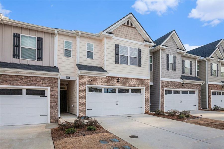 Front exterior of a new home in , Lawrenceville, GA, highlighting curb appeal (Image 2). Front exterior of a new home in , Lawrenceville, GA, highlighting curb appeal (Image 2).