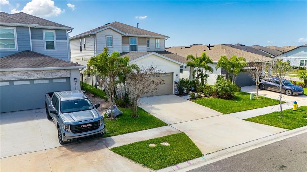 Front exterior of a new home in , Apollo Beach, FL, highlighting curb appeal (Image 27).