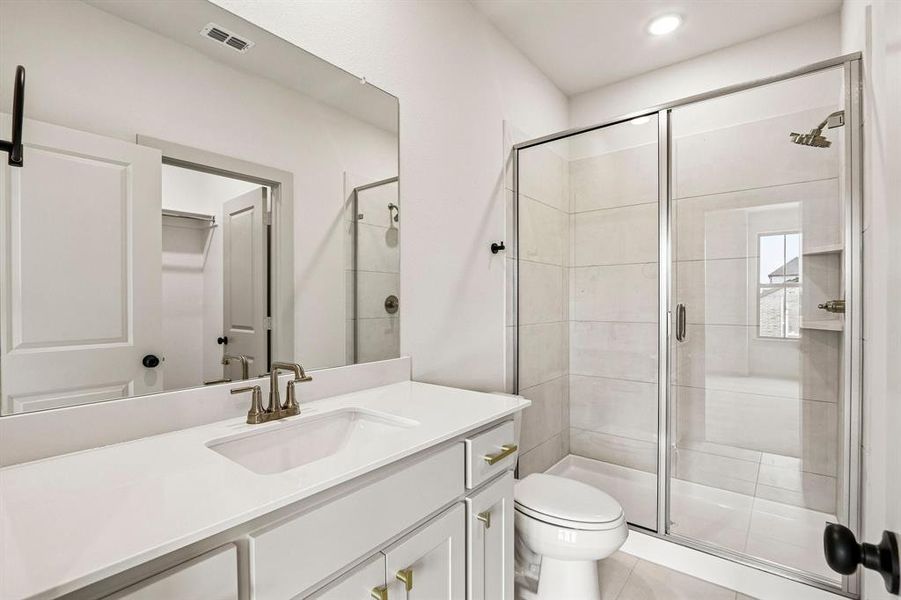 Friends and family will feel right at home in any of the beautifully finished guest baths.