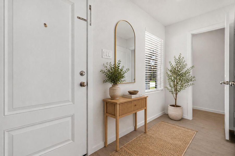 The bright foyer sets the tone for the home's clean, modern design.Home is virtually staged