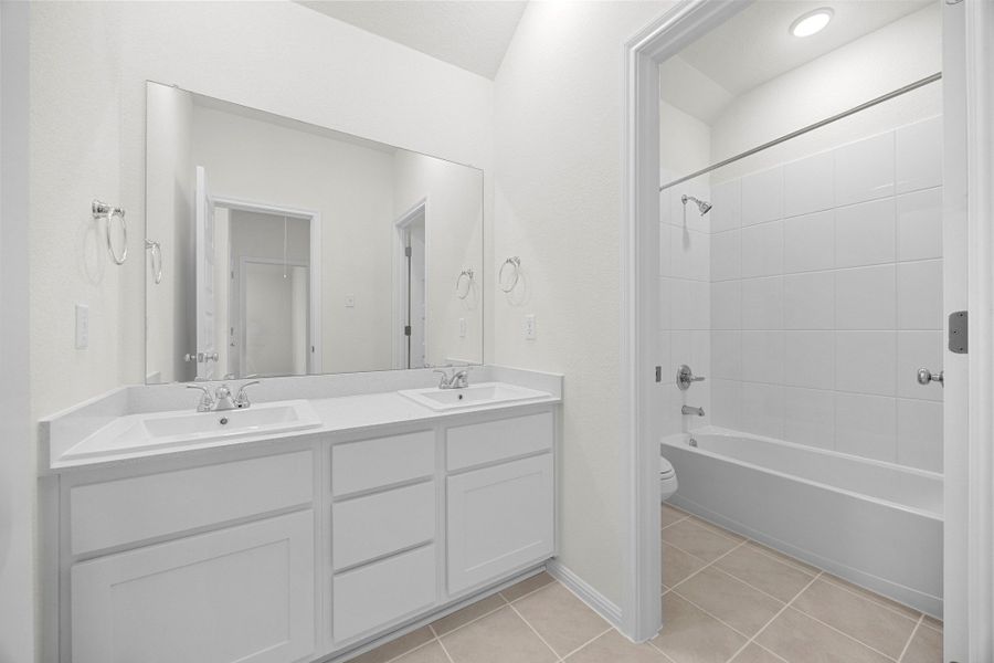 Bathroom in the Magnolia home plan by Trophy Signature Homes – REPRESENTATIVE PHOTO