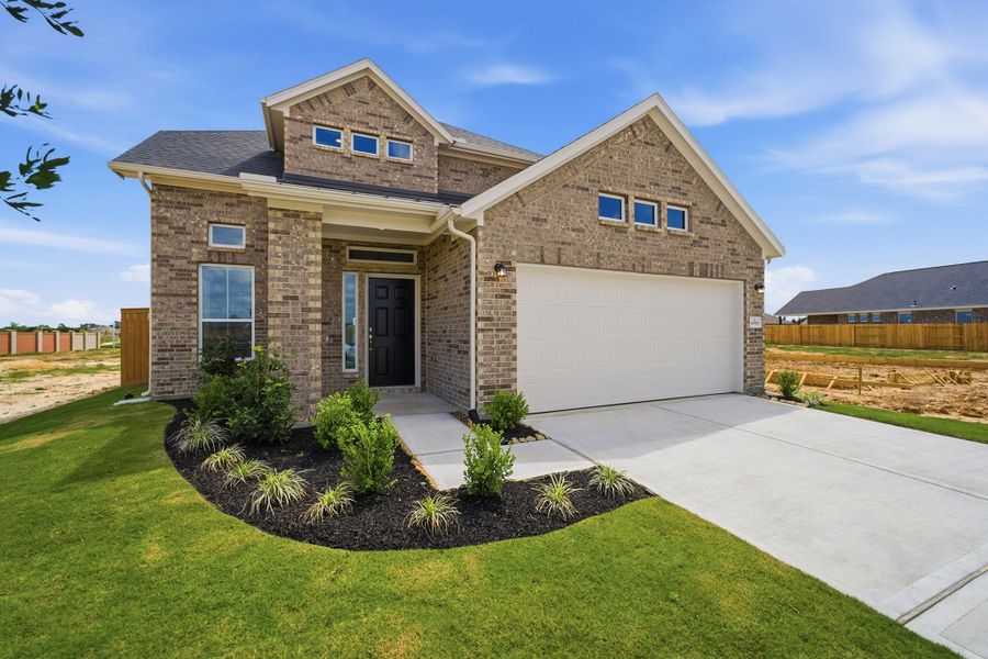 Front exterior of a new home in Wildrye, Waller, TX, highlighting curb appeal (Image 2).