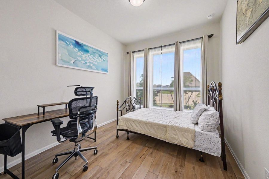 Secondary bedroom with front yard views. Secondary bedroom with front yard views.