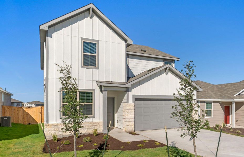 Front exterior of a new home in Sonterra, Jarrell, TX, highlighting curb appeal (Image 18). Front exterior of a new home in Sonterra, Jarrell, TX, highlighting curb appeal (Image 18).