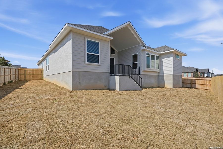Exterior details and patio area of a home in Potranco Oaks, Castroville (Image 4).