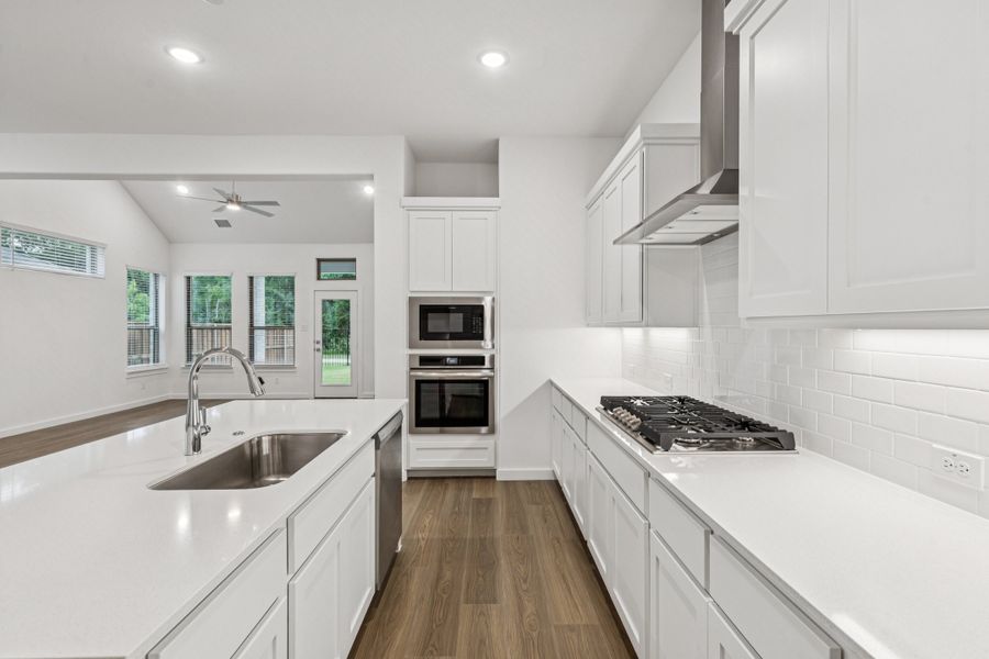 Kitchen in the Picasso II home plan by Trophy Signature Homes – REPRESENTATIVE PHOTO