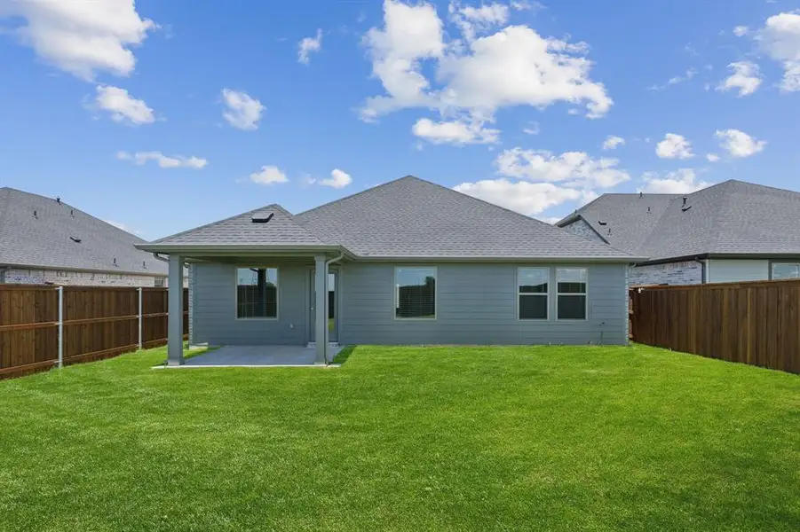 Front exterior of a new home in Trails of Lavon, Lavon, TX, highlighting curb appeal (Image 2). Front exterior of a new home in Trails of Lavon, Lavon, TX, highlighting curb appeal (Image 2).