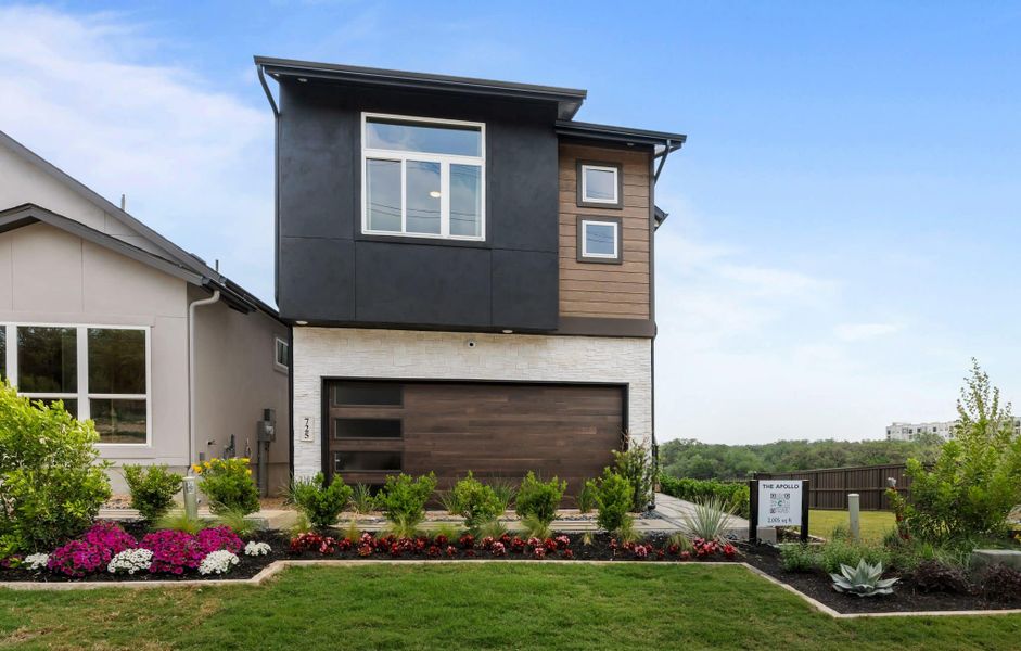 Front exterior of a new home in Santa Rita Ranch, Liberty Hill, TX, highlighting curb appeal (Image 26).