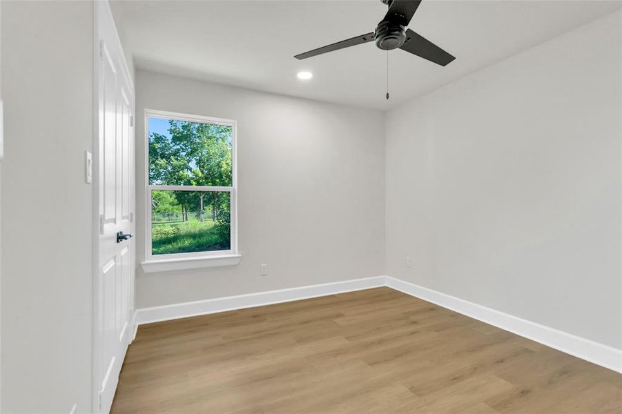 Spare room featuring light wood-type flooring, recessed lighting, and ceiling fan Spare room featuring light wood-type flooring, recessed lighting, and ceiling fan
