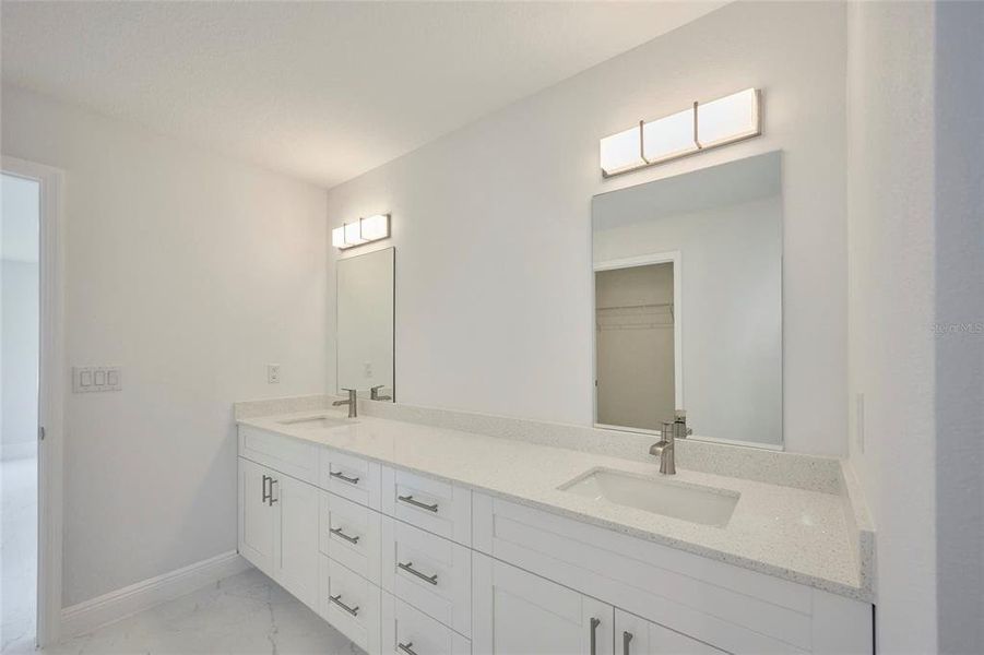 Double sink vanity in master ensuite.