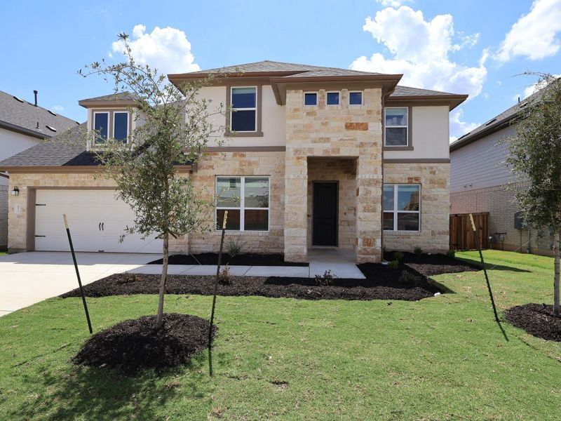 Front exterior of a new home in Edgewood, Leander, TX, highlighting curb appeal (Image 20).
