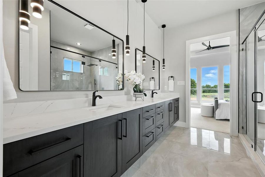 Full bathroom featuring plenty of natural light, ceiling fan, double vanity, and a stall shower