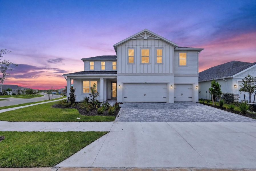 Representative exterior photo of a completed home built from the Jasper by William Ryan Homes in The Sanctuary – Royal Collection, Punta Gorda, FL (Image 11).