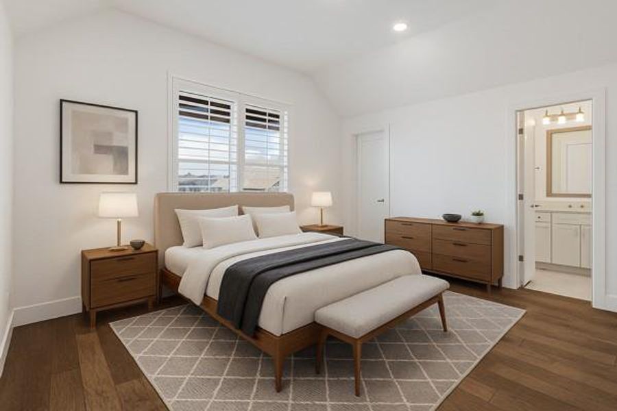 Bedroom with vaulted ceiling, dark wood-style flooring, recessed lighting, and connected bathroom Bedroom with vaulted ceiling, dark wood-style flooring, recessed lighting, and connected bathroom