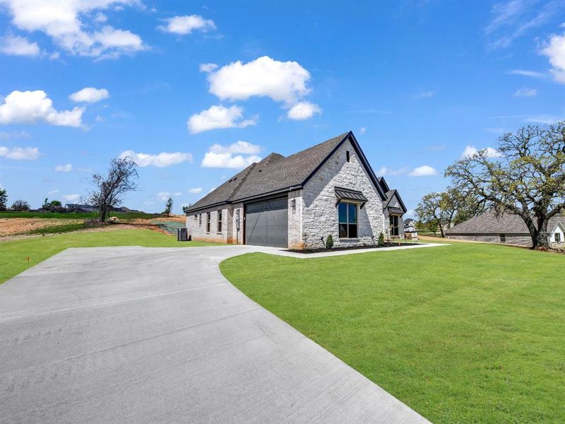 Front exterior of a new home in , Springtown, TX, highlighting curb appeal (Image 20).
