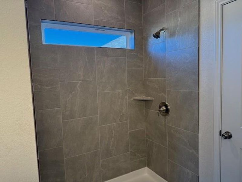 Bathroom with tiled shower Bathroom with tiled shower