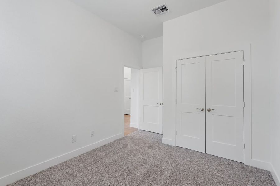 Representative unfurnished interior of a home built from the Torrey Pines by Chesmar Homes in Riceland Alley Loads, Mont Belvieu (Image 12).