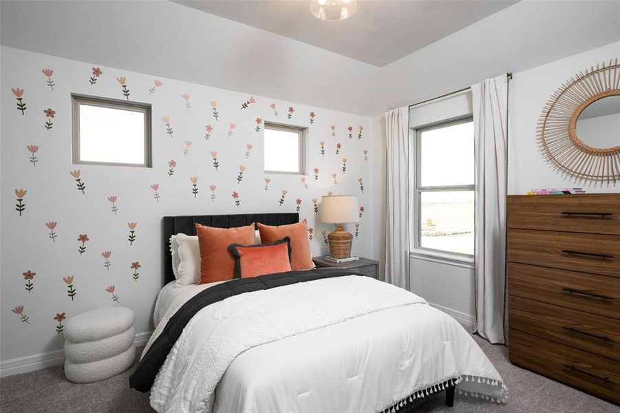 Your secondary bedroom features plush carpet, fresh paint, closet, and a large window that lets in plenty of natural lighting.