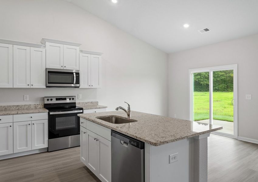 The kitchen overlooks the dining area