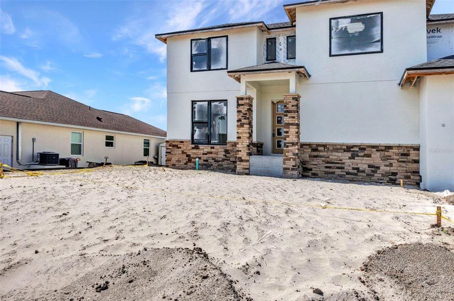 Front exterior of a new home in , Port Charlotte, FL, highlighting curb appeal (Image 25).