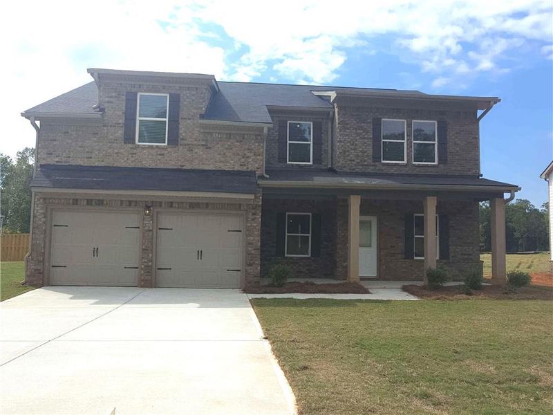 Front exterior of a new home in Southern Hills, McDonough, GA, highlighting curb appeal (Image 14).