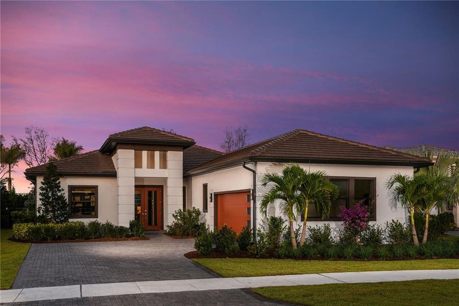 Front exterior of a new home in Cresswind Lakewood Ranch, Lakewood Ranch, FL, highlighting curb appeal (Image 23). Front exterior of a new home in Cresswind Lakewood Ranch, Lakewood Ranch, FL, highlighting curb appeal (Image 23).