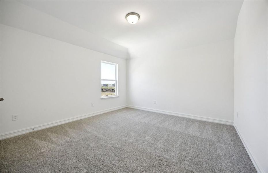 Comfortable bedroom with a bright window view Comfortable bedroom with a bright window view