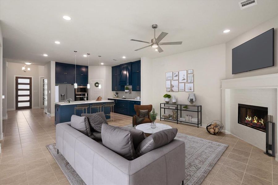 Living area with recessed lighting, ceiling fan, a corner fireplace, and tile floors.  (Photo has been virtually staged)