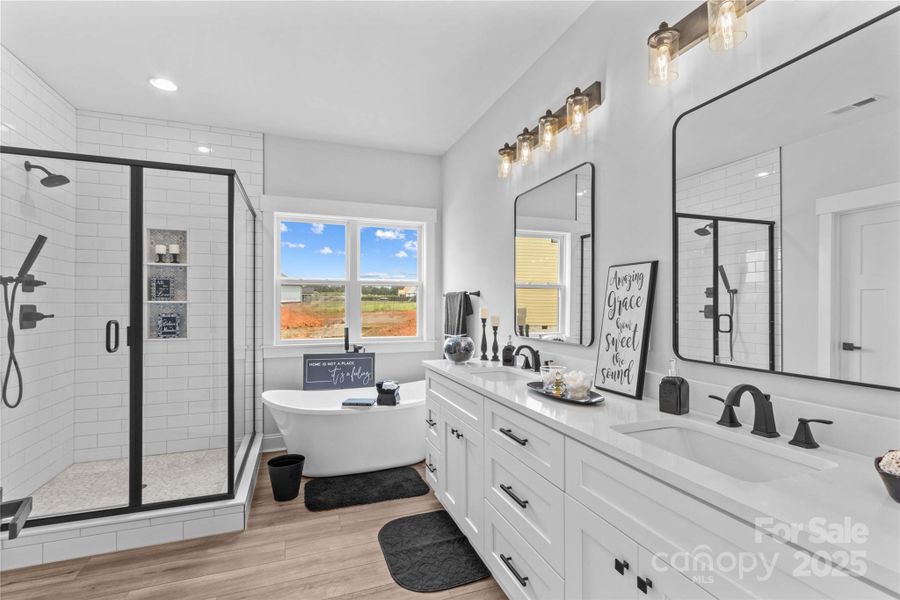Spa like main Bath with quartz vanities.