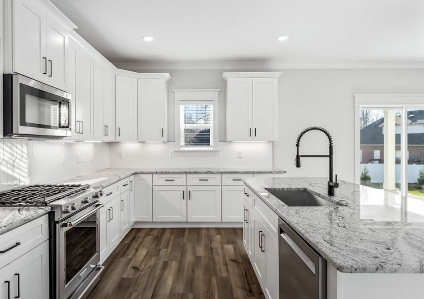 Top of the line kitchen appliances are included in the home.