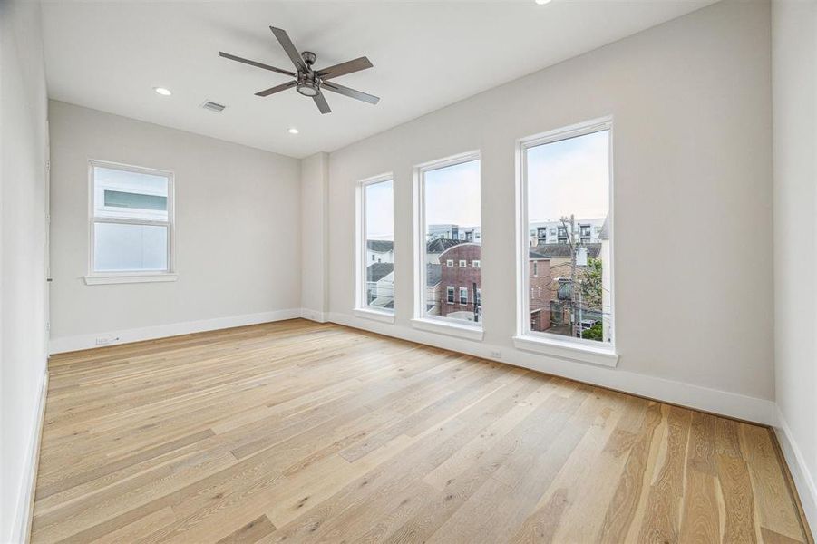 Third bedroom on the third floor, featuring convenient access to Hollywood bath and walk-in closet.