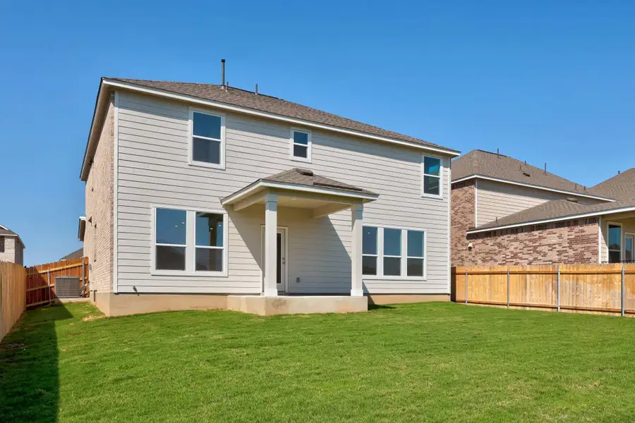 Front exterior of a new home in Salerno - Classic Collection, Round Rock, TX, highlighting curb appeal (Image 2). Front exterior of a new home in Salerno - Classic Collection, Round Rock, TX, highlighting curb appeal (Image 2).