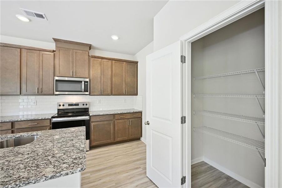 Furnished interior view inside a new home in Hawthorne Station, College Park (Image 7).