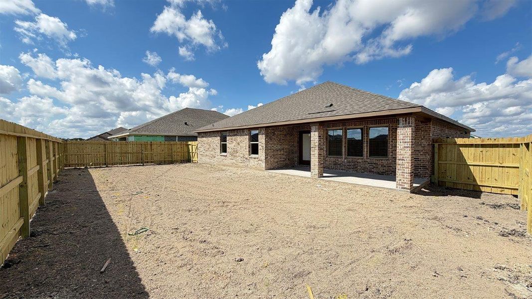 Exterior details and patio area of a home in The Lakes Northwest, Robstown (Image 19).