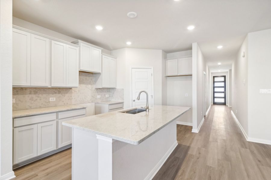 Kitchen in the Briscoe floorplan at a Meritage Homes community.