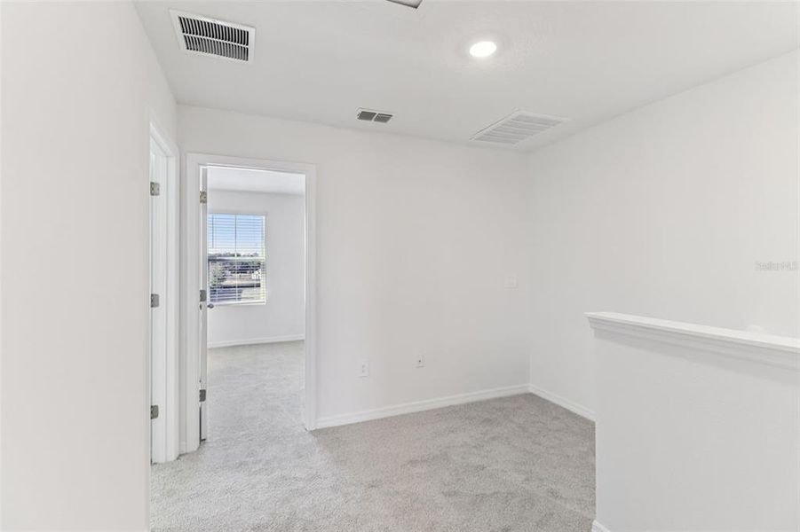 Spacious, unfurnished interior of a new home in The Reserve at Hammock Oaks Townes, Lady Lake (Image 25).