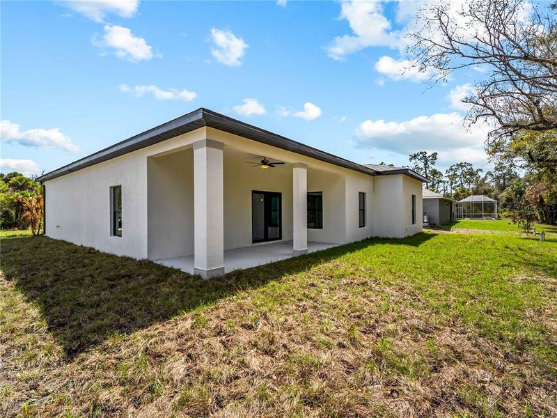 Exterior details and patio area of a home in , North Port (Image 40).