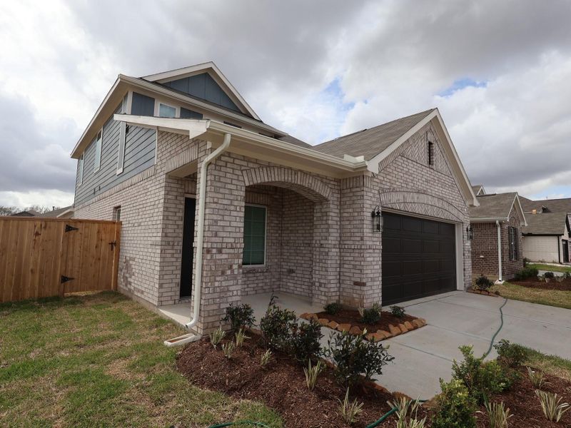 Front exterior of a new home in Miller's Pond, Rosenberg, TX, highlighting curb appeal (Image 20).