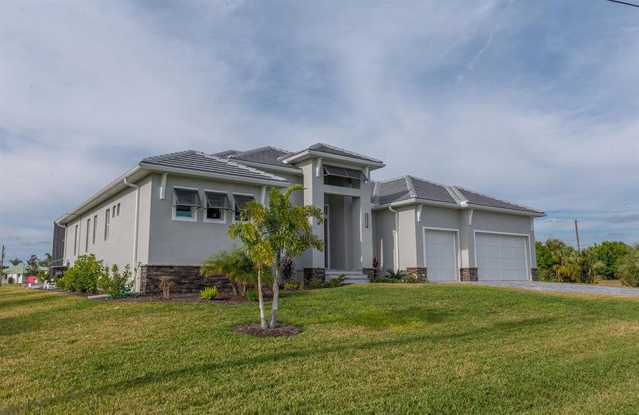 Front exterior of a new home in , Punta Gorda, FL, highlighting curb appeal (Image 22).
