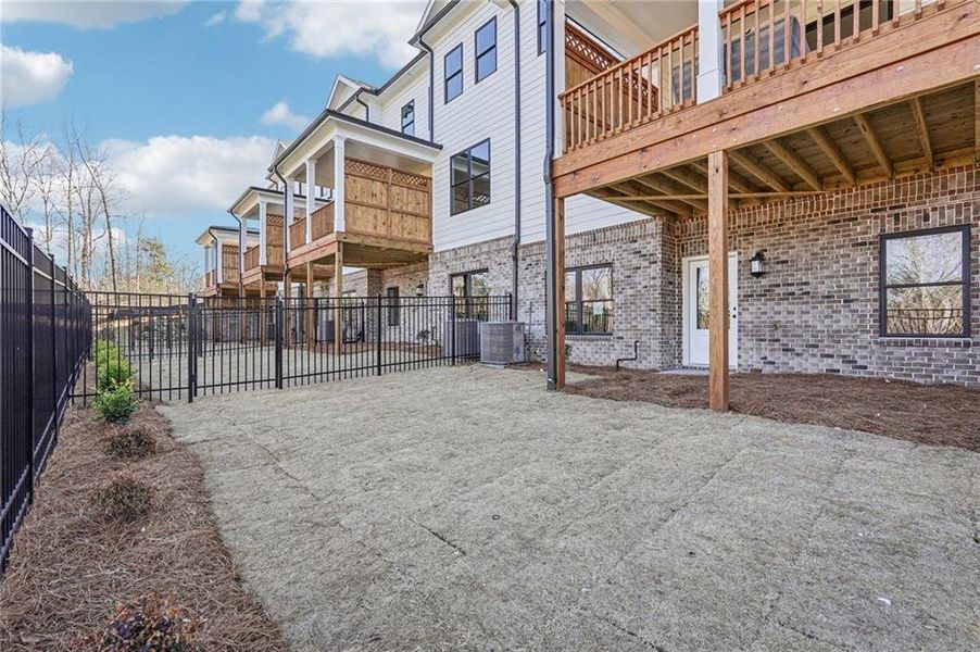 Exterior details and patio area of a home in Millcroft Townhomes, Buford (Image 26). Exterior details and patio area of a home in Millcroft Townhomes, Buford (Image 26).