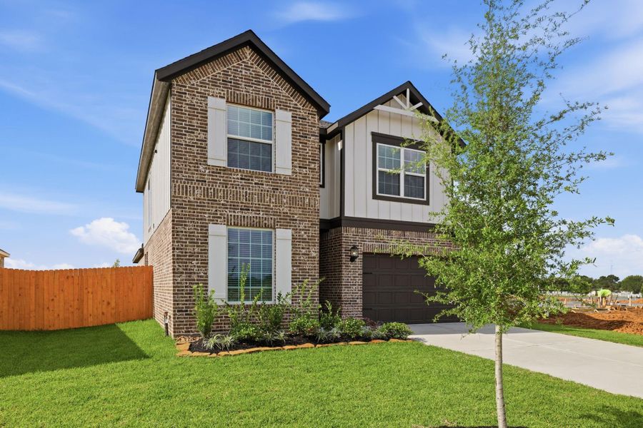 Front exterior of a new home in Sunterra, Katy, TX, highlighting curb appeal (Image 1). Front exterior of a new home in Sunterra, Katy, TX, highlighting curb appeal (Image 1).