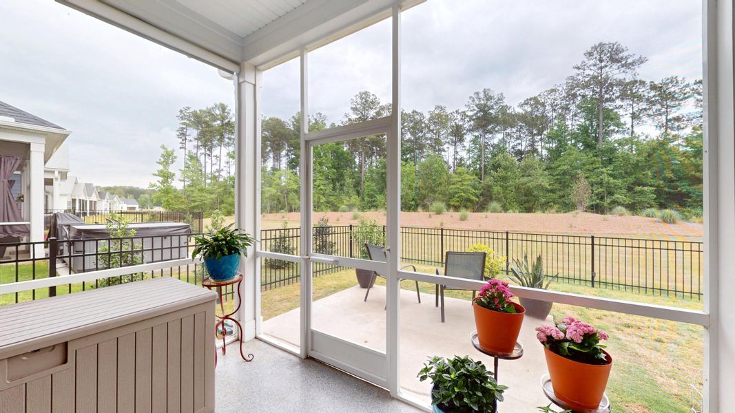 Exterior details and patio area of a home in Summerwind Crossing at Lakes of Cane Bay, Summerville (Image 28).