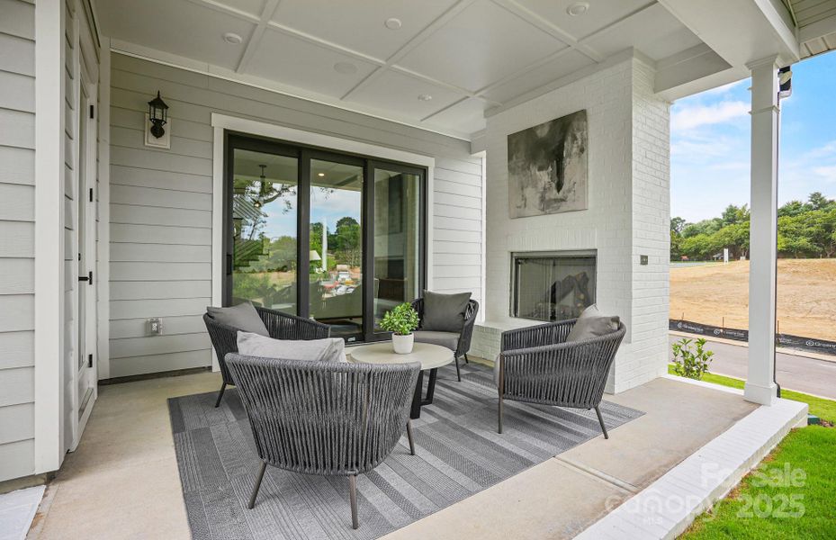 Covered porch with exterior gas fireplace