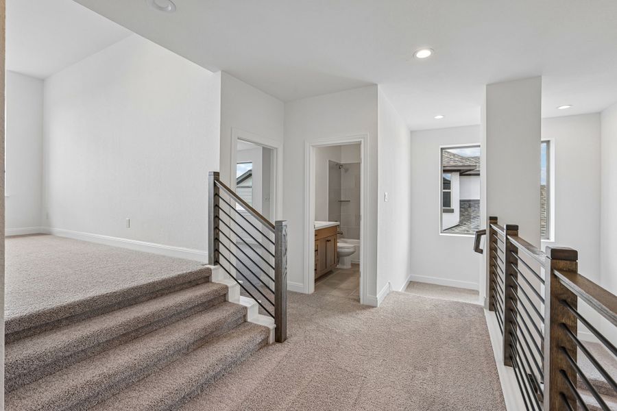 Furnished interior view inside a new home in 6 Creeks, Kyle (Image 10).